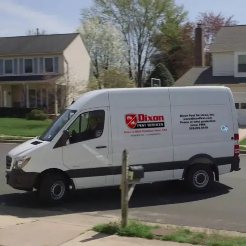 Dixon Pest Services van pulling into the driveway of a residential home in Baymeadows to perform pest control